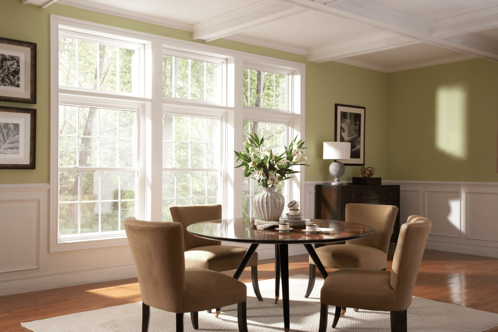 Signature Elite double hung windows in white with grids and transom windows above.